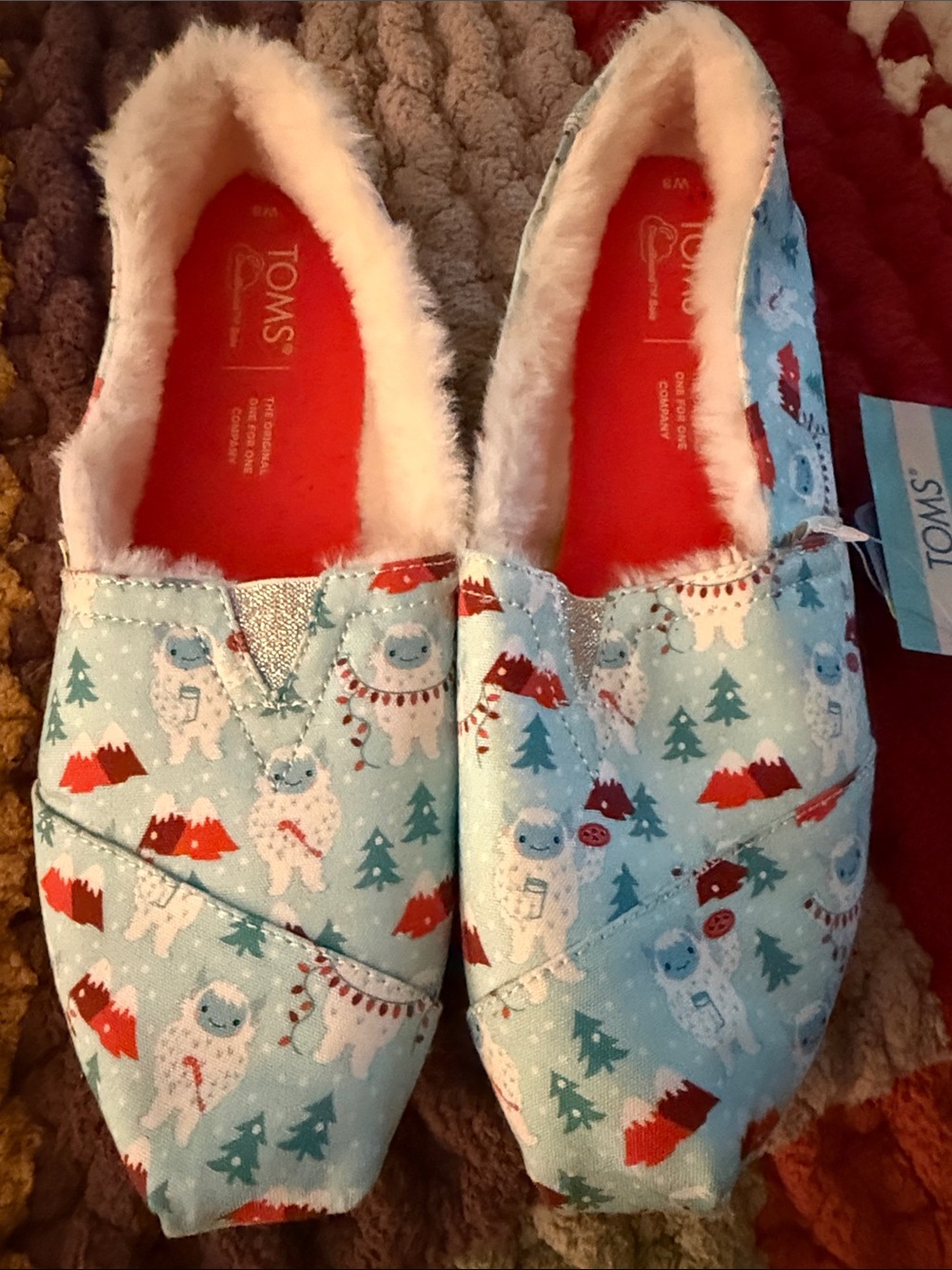 TOMS Light Blue Holiday Yeti Slip-Ons with Red Insoles